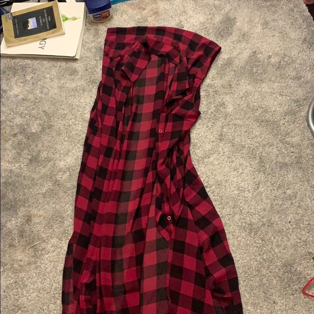 It’s a long flowy plaid cardigan no sleeves